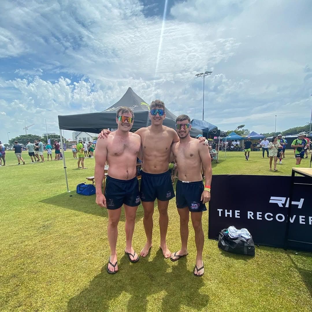 Three Raptors players shirtless at the recovery tent